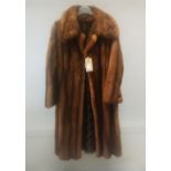 A GOOD LONDON MINK FUR COAT with mink strap.