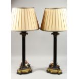 A VERY GOOD PAIR OF VICTORIAN BRONZE AND ORMOLU LAMPS, the bases with winged griffins. 1ft 8ins