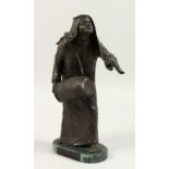 ANNE ROONEY (AMERICAN) "THE DRUMMER", standing Arab male figure playing a drum. 35cms high.