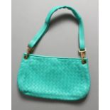 A BOTTEGA VENETA TURQUOISE BAG.