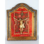 A VERY EARLY 16TH-17TH CENTURY CARVED WOOD AND PAINTED CORPUS CHRISTI, on a velvet background in a