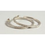 A PAIR OF 18CT WHITE GOLD DIAMOND HOOP EARRINGS.