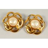 A PAIR OF FLOWER HEAD DESIGN CLIP EARRINGS, with central large pearl. 3.5cms wide.