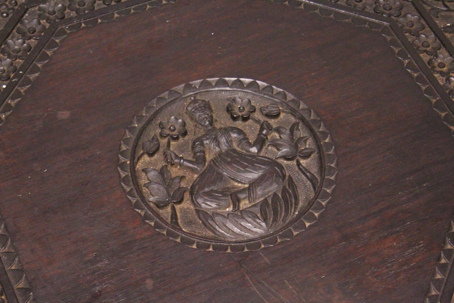 AN EARLY 20TH CENTURY CEYLONESE CARVED EBONY LOW TABLE, with an elephant head leg to each corner. - Image 3 of 5