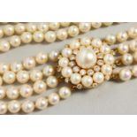 A FOUR-ROW STRING OF PEARLS with diamond clasp.