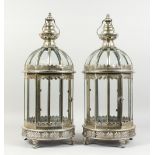 A PAIR OF SILVER COLOUR HANGING LANTERNS. 24ins high.