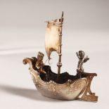 A BERNARD MULLER SILVER BOAT with cupids, 3ins long, with Chester Import Mark 1901.