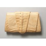 EILEEN KRAMER, A FOLDING CROCODILE-SKIN BAG.