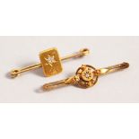 TWO GOLD AND DIAMOND SET BAR BROOCHES.