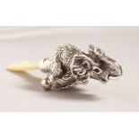 A SILVER AND MOTHER-OF-PEARL ELEPHANT BABIES RATTLE.