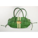 A LARGE GREEN PRADA BAG.