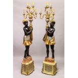 A PAIR OF BLACKAMOOR FLOOR STANDING CANDELABRA.