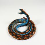 A TURKISH PRISONER OF WAR BEAD WORK MODEL OF A SNAKE. 58ins long.