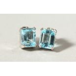 A PAIR OF SILVER AND BLUE TOPAZ EARRINGS.