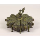 A BRONZE NINE DIVISION SPICE BOX, with cockerel finial. 7.5ins wide.