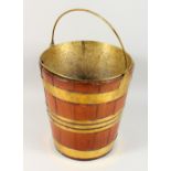 A BRASS BOUND WOODEN BUCKET, with liner. 13ins high.