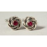 A PAIR OF SILVER RUBY KNOT CUFFLINKS.