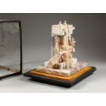 AN UNUSUAL MARBLE MODEL OF A STATIONARY STEAM ENGINE, in a glass display case. Model: 10ins high.