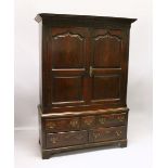 AN 18TH CENTURY OAK BACON CUPBOARD, with a moulded cornice, blind fret decorated frieze above a pair