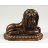 A 19TH CENTURY CAST IRON DOORSTOP, modelled as a lion. 8.5ins long.
