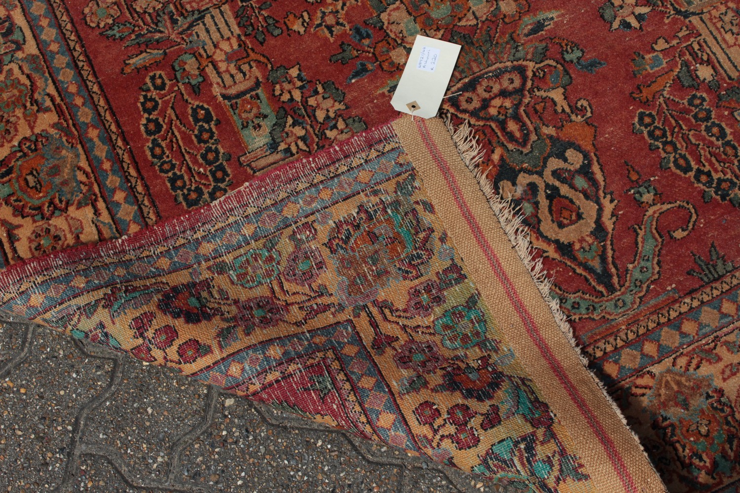 A PERSIAN KASHAN RUG with floral central motifs on a red ground with foliate border. 6ft 6ins x - Image 9 of 10