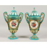 A GOOD PAIR OF SEVRES BLUE GROUND TWO-HANDLED VASES AND COVERS, with gilt decoration and reverse