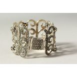 A SILVER WIDE MARCASITE BRACELET.