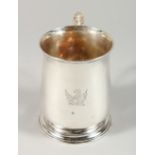 A GEORGE III WHITE METAL PINT TANKARD with winged eagle crest.