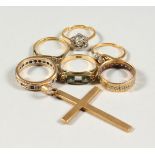 A 9CT GOLD CRUCIFIX AND SIX RINGS, 20gms.