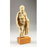 A MUSEUM COPY OF A ROMAN EMPEROR, on a wooden base. 12.5ins high overall.