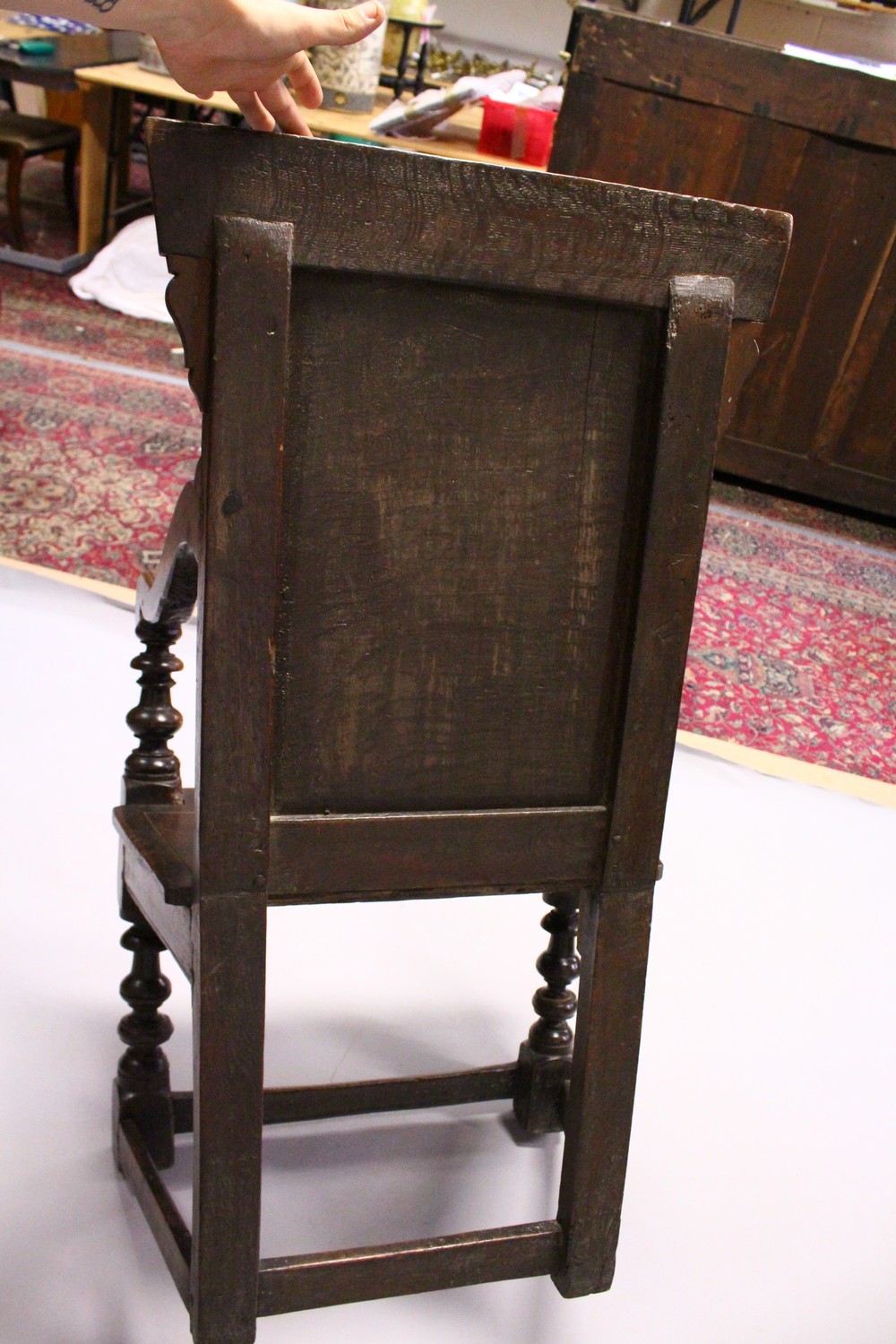 AN 18TH CENTURY OAK WAINSCOT ARMCHAIR, with carved back, solid seat and curving arms and turned - Image 8 of 11