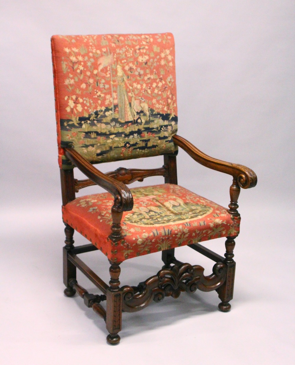 A CONTINENTAL 18TH CENTURY STYLE WALNUT ARMCHAIR, with tapestry upholstered back and seat, turned