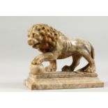 A GOOD MEDICI CARVED MARBLE LION on a stand. 10ins long.