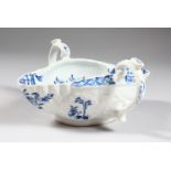 AN 18TH CENTURY WORCESTER TWO-HANDLED SAUCEBOAT, painted with a Chinese landscape in under-glaze