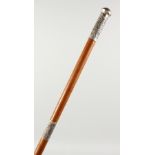 AN INDIAN SILVER MOUNTED WALKING CANE. 3ft long.