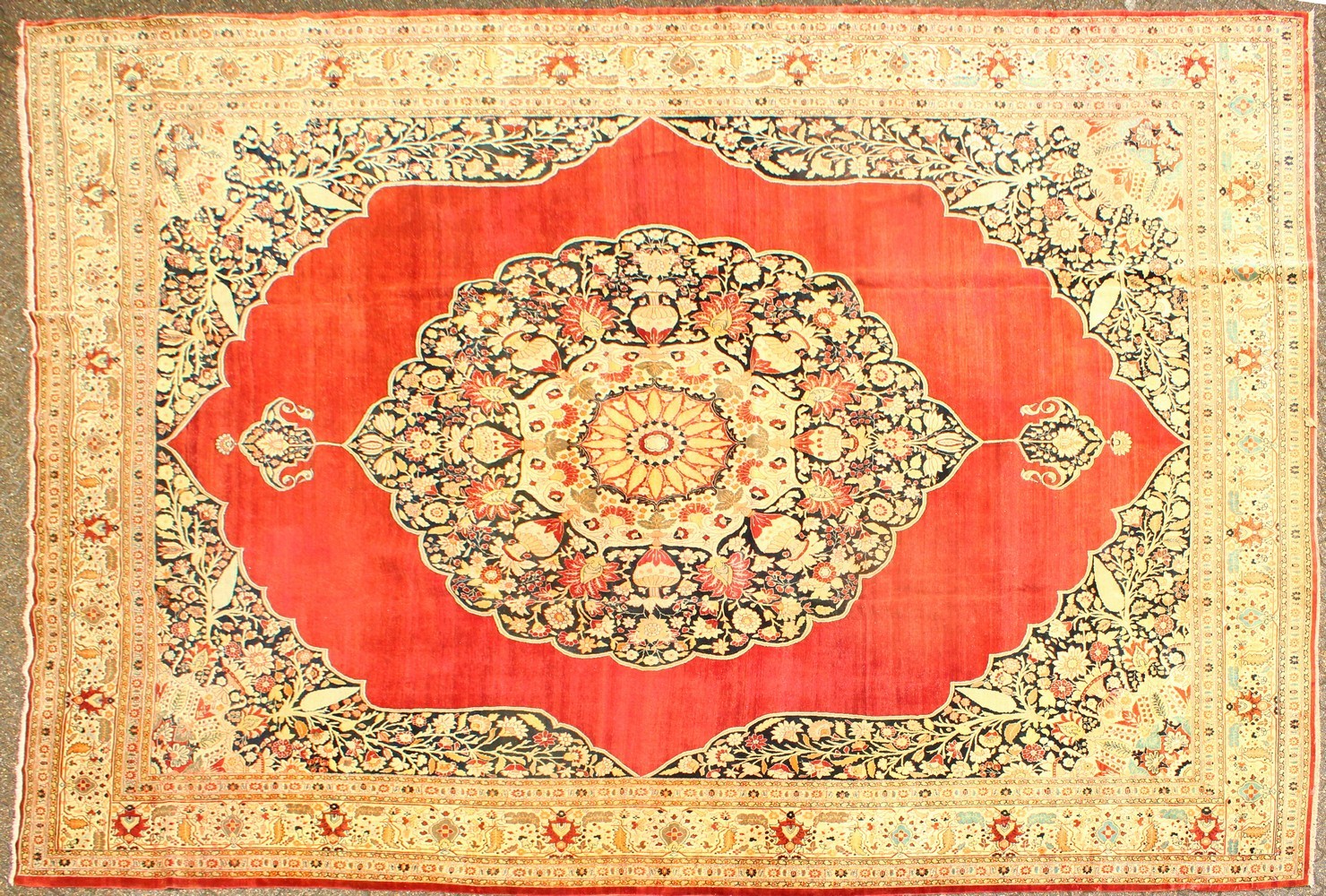 A GOOD LARGE RARE HAJI JALILI TABRIZ CARPET, red ground with a large central medallion with