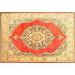 A GOOD LARGE RARE HAJI JALILI TABRIZ CARPET, red ground with a large central medallion with