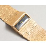 A 9CT GOLD WRISTWATCH AND BRACELET. 46 grams including works.