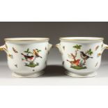 A GOOD PAIR OF HEREND CIRCULAR JARDINIERES, painted with birds and butterflies with scroll handle.