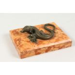 A BRONZE MODEL OF A LIZARD, on a marble base. 5.5ins long overall.