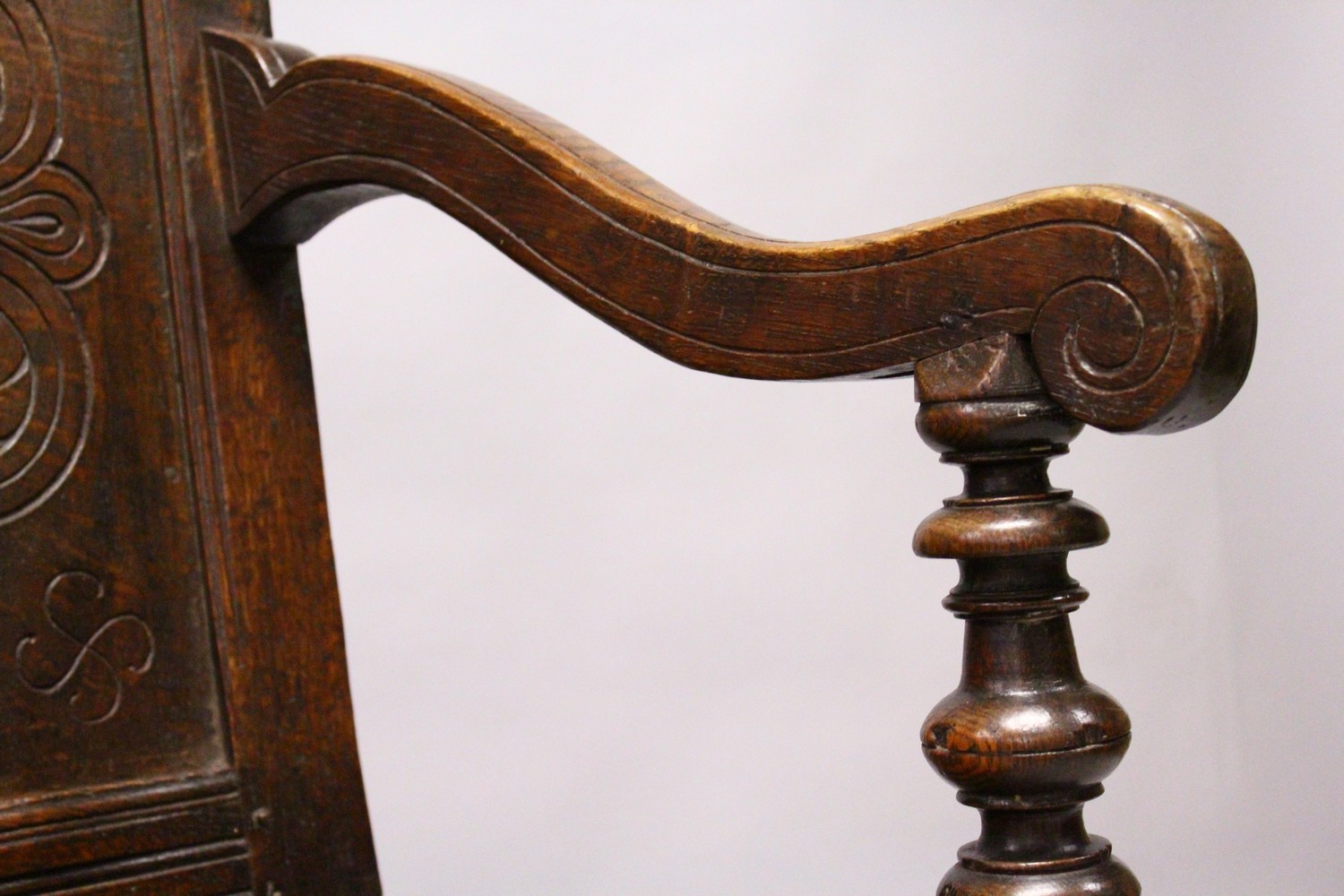 AN 18TH CENTURY OAK WAINSCOT ARMCHAIR, with carved back, solid seat and curving arms and turned - Image 4 of 11