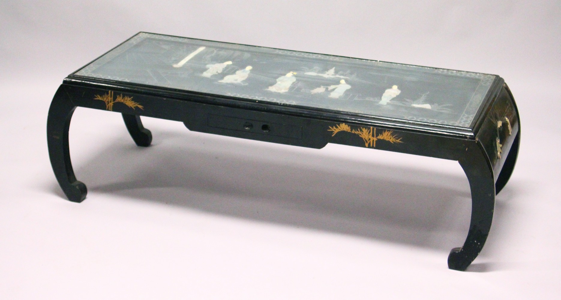 A 20TH CENTURY CHINESE LACQUER LOW TABLE, the top with mother-of-pearl onlaid decoration depicting