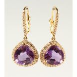 A PAIR OF 14K YELLOW GOLD AND DIAMOND EARRINGS, set with a pair of pear shape purple amethysts