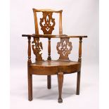 AN 18TH CENTURY OAK CORNER CHAIR, the curving back with pierced splats, solid seat on plain legs and