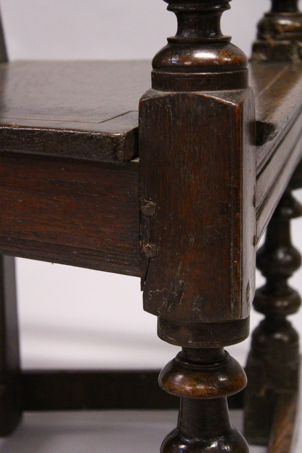 AN 18TH CENTURY OAK WAINSCOT ARMCHAIR, with carved back, solid seat and curving arms and turned - Image 11 of 11