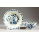 AN 18TH CENTURY WORCESTER BREAKFAST FACETED TEA BOWL AND SAUCER, painted in blue under-glaze with