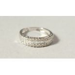 AN 18CT GOLD THREE-ROW DIAMOND ETERNITY RING.