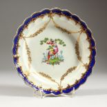 A FINE 18TH CENTURY WORCESTER PLATE, painted with two exotic birds in a landscape surrounded by gilt