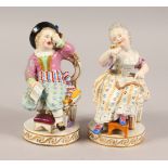 A GOOD PAIR OF MEISSEN FIGURES OF A SEATED LADY reading a book, and a boy yawning. Cross swords mark