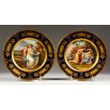 A SUPERB PAIR OF VIENNA PLATES, "Schlafende Amor" and "Amor Belehirt di Venus". Beehive mark in